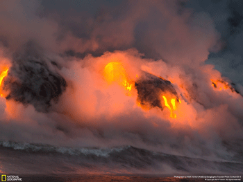 Lava flowing into the ocean.  Credit: National Geographic Traveler 
                Photo Contest 2013, &copy; Mark Venner