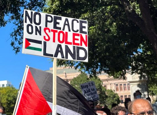 Palestinian protest sign against Israel occupying Israel's land.